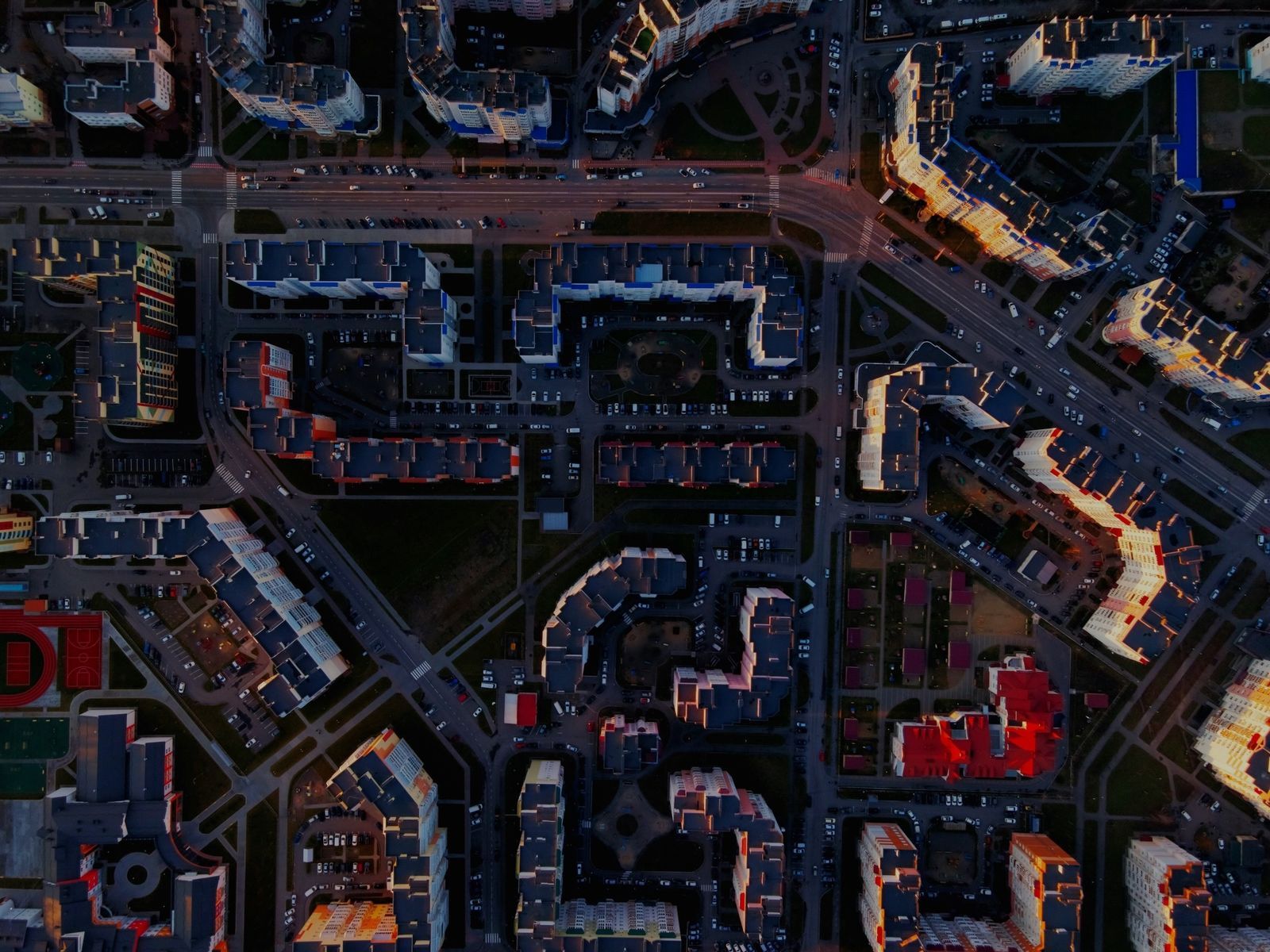 Aerial view of a dense city grid at dusk